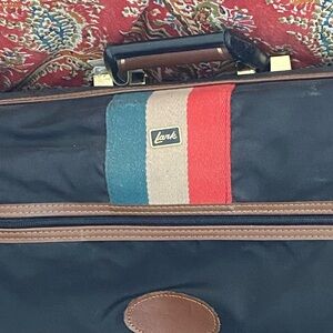 Black and Brown Travel Bag with Multicolor Stripes